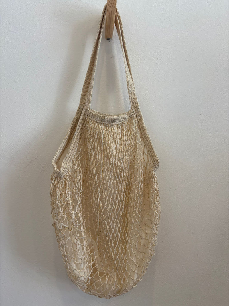 Bolso en tela forma de red en crema