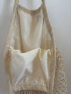 Bolso en tela forma de red en crema