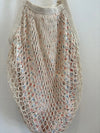 Bolso en tela forma de red en crema forro estampado